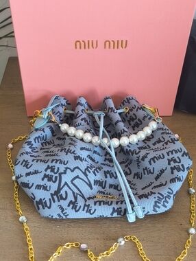 Miu Miu Light Blue Logo Drawstring Shoulder Bag with Pearl Accent and Gold Chain